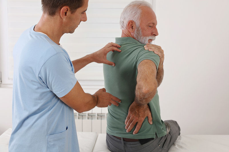 Senior-patient-being-evaluated-for-spinal-stenosis